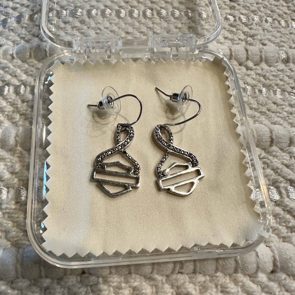 Harley Davidson Silver Earrings with Rhinestones surrounding the HD shield.